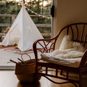 Select a cosy corner or nook in your home, then make it comfy and inviting for your child.